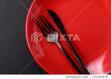 Empty ceramic round plate on dark textured concrete background 115364670