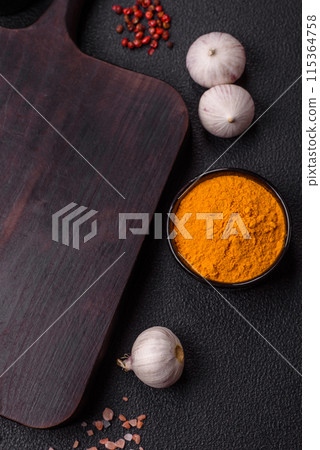 Empty wooden cutting board with spices, salt and herbs 115364758