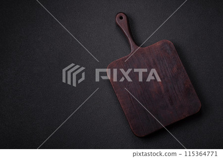 Empty wooden cutting board with spices, salt and herbs Empty wooden cutting board with spices, salt and herbs 115364771