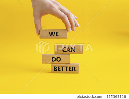 We Can Do Better symbol. Concept words We Can Do Better on wooden blocks. Beautiful yellow background. Businessman hand. Business and We Can Do Better concept. Copy space. We Can Do Better symbol. Concept words We Can Do Better on wooden blocks. Beautiful yellow background. Businessman hand. Business and We Can Do Better concept. Copy space. 115365116