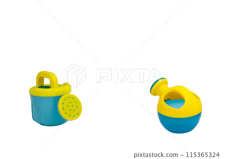 Children's toys for playing in sand. Two watering cans for sandbox without background. For text Children's toys for playing in sand. Two watering cans for sandbox without background. For text 115365324
