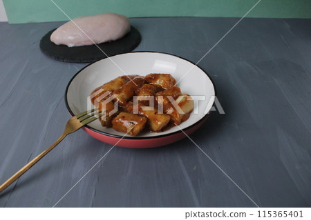 Mini chicken sausages chicken fillet and chicken breast on a gray background. Chicken Cooking Concept Mini chicken sausages chicken fillet and chicken breast on a gray background. Chicken Cooking Concept 115365401