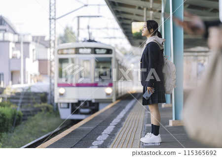 High school girls waiting for the train on the station platform Photography cooperation: Keio Electric Railway 115365692