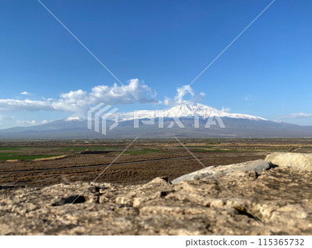 Ararat mount with a snow-capped peak in clear weather. Mountain picturesque landscape Ararat mount with a snow-capped peak in clear weather. Mountain picturesque landscape 115365732