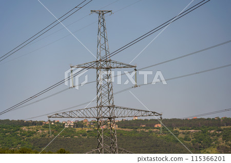High voltage towers with sky background. Power line support with wires for electricity transmission. High voltage grid tower with wire cable at distribution station. Energy industry, energy saving High voltage towers with sky background. Power line support with wires for electricity transmission. High voltage grid tower with wire cable at distribution station. Energy industry, energy saving 115366201