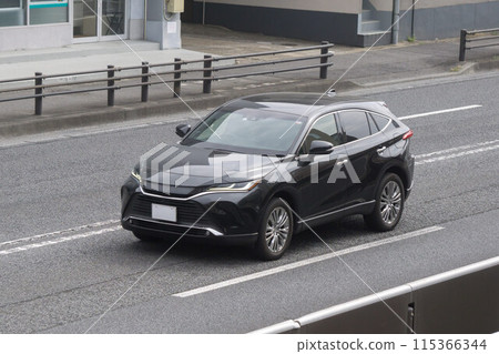 SUV utility vehicle road driving 115366344