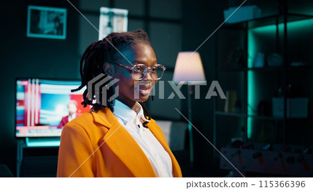 Portrait of african american college student does remote work at home, studying english literature on online classes. Learning languages through academic platforms software or courses. Camera B. Portrait of african american college student does remote work at home, studying english literature on online classes. Learning languages through academic platforms software or courses. Camera B. 115366396