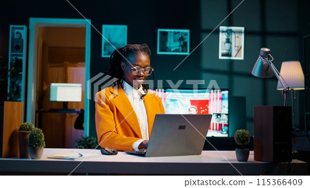 Dedicated student doing school research analyzing case studies or real scenarios relevant to coursework, creative education. Young woman preparing materials for future online lessons. Camera B. 115366409