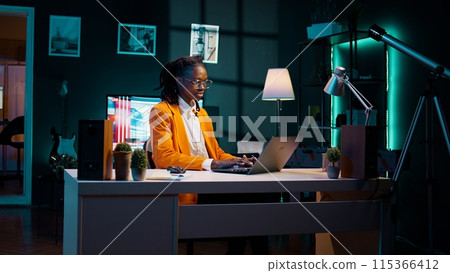 Young woman resolving her school homework and acquiring additional information, participating in online workshops or training sessions. Student practicing problem solving skills. Camera B. Young woman resolving her school homework and acquiring additional information, participating in online workshops or training sessions. Student practicing problem solving skills. Camera B. 115366412