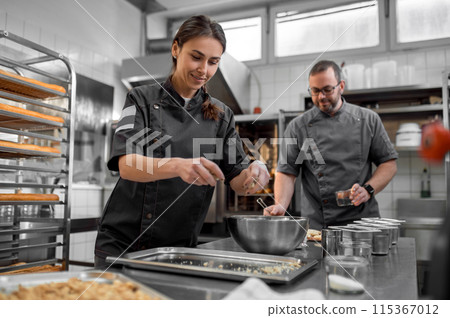 Man and woman preparing French baguettes in kitchen Man and woman preparing French baguettes in kitchen 115367012