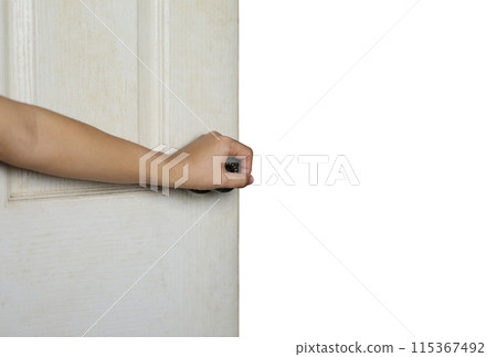 Woman's hand holding a door handle and blank space behind. 115367492