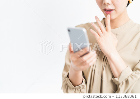 Female (parts) operating a smartphone Female (parts) operating a smartphone 115368361