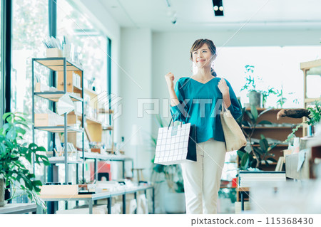 Young woman shopping at a select shop Young woman shopping at a select shop 115368430