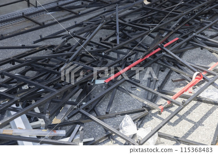 Many metal frames at a demolition site 115368483
