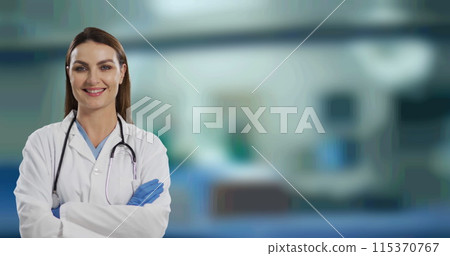 Portrait of caucasian female doctor with arms crossed smiling against hospital in background Portrait of caucasian female doctor with arms crossed smiling against hospital in background 115370767