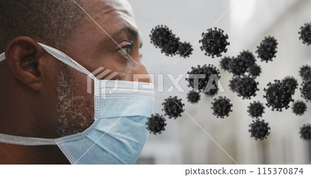 Image of covid 19 cells over african american man wearing face mask Image of covid 19 cells over african american man wearing face mask 115370874