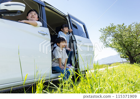 Child peeking out of car window Child peeking out of car window 115371909