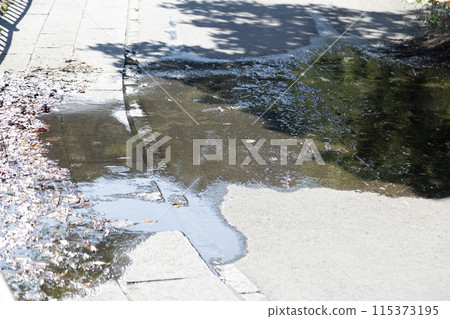 Water standing on the road 115373195