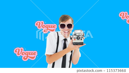 Image of retro vogue text over male photographer with vintage camera on blue background 115373668