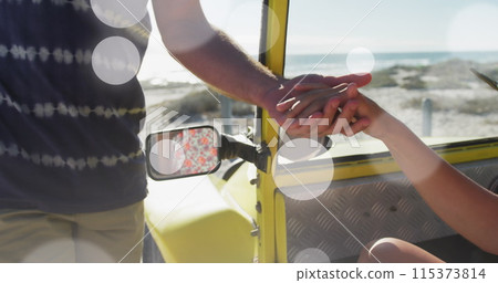 Image of spots over caucasian couple at beach Image of spots over caucasian couple at beach 115373814