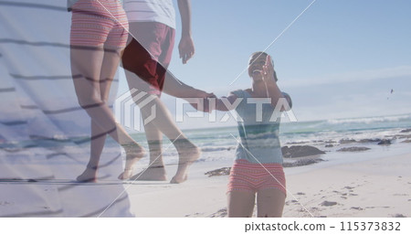 Image of happy african american couple having fun on beach over seascape 115373832