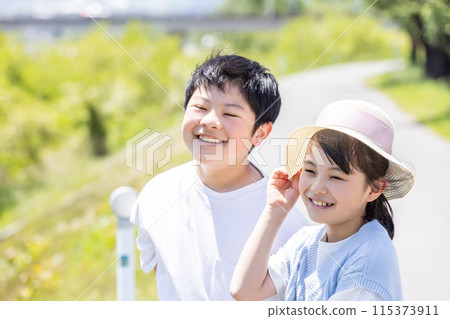 Child smiling outdoors Child smiling outdoors 115373911