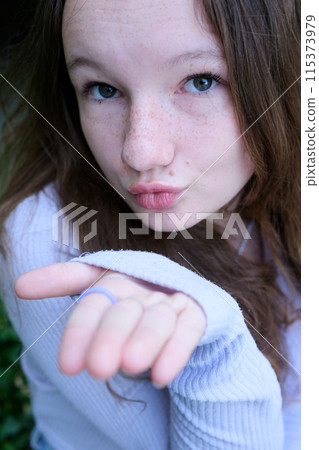 Air kiss girl Charming lovely woman sending an air kiss. Confess love lo a guy Air kiss girl Charming lovely woman sending an air kiss. Confess love lo a guy 115373979