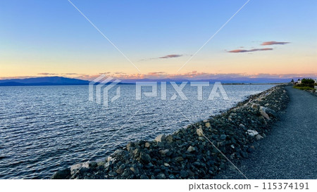 complete calm no wind no waves on the pacific ocean looks like a lake on Vancouver island blue tranquility and peace a great place to relax background for any text Parksville beach Surfside RV resort complete calm no wind no waves on the pacific ocean looks like a lake on Vancouver island blue tranquility and peace a great place to relax background for any text Parksville beach Surfside RV resort 115374191