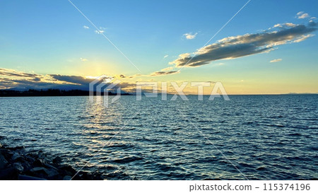 complete calm no wind no waves on the pacific ocean looks like a lake on Vancouver island blue tranquility and peace a great place to relax background for any text Parksville beach Surfside RV resort complete calm no wind no waves on the pacific ocean looks like a lake on Vancouver island blue tranquility and peace a great place to relax background for any text Parksville beach Surfside RV resort 115374196