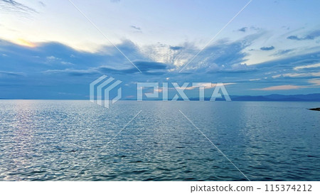 drift ice in the sea of okhotsk Abstract sky and ocean nature background with blurred panning motion start the adventure. Motivational quote on the ocean background 115374212