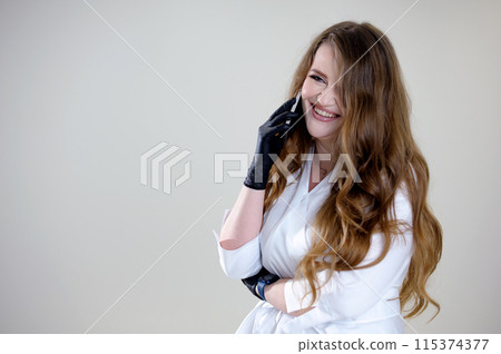 woman in white clothes doctor talking on the phone Hand in black glove holding mobile phone with blank screen on white background. Isolated with clipping path. 115374377