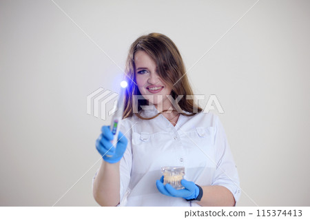 Beautiful young woman with healthy teeth and tooth fairy on white background 115374413
