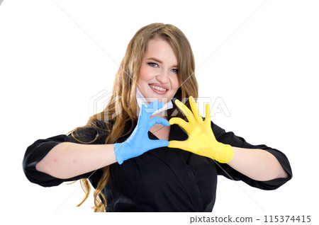 a female doctor in a mask makes a heart shape with her hands yellow and blue glove flag of ukraine aid to ukraine aid to refugees on a white background space for text patriotism war in ukraine a female doctor in a mask makes a heart shape with her hands yellow and blue glove flag of ukraine aid to ukraine aid to refugees on a white background space for text patriotism war in ukraine 115374415