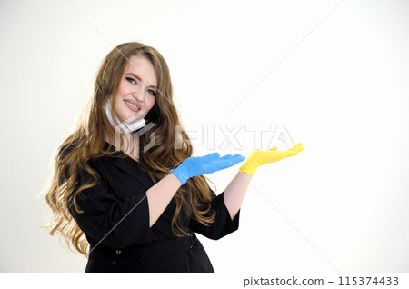 blue yellow glove Beautiful woman wearing cleaner apron and gloves smiling and looking at the camera pointing with two hands and fingers to the side. blue yellow glove Beautiful woman wearing cleaner apron and gloves smiling and looking at the camera pointing with two hands and fingers to the side. 115374433