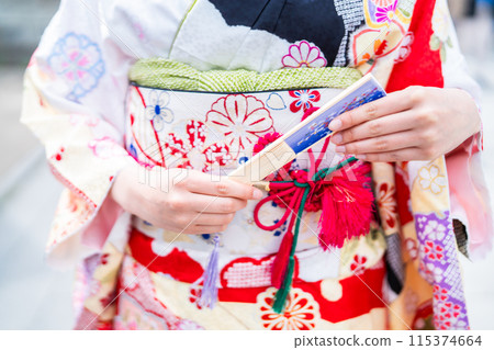 Young woman wearing furisode, body parts 115374664