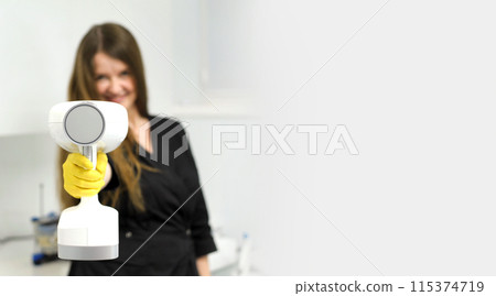 portable x-ray beautiful young female doctor in her hands with a portable x-ray prepared to take a picture for an advertisement banner beautifully interesting bright space for text white background portable x-ray beautiful young female doctor in her hands with a portable x-ray prepared to take a picture for an advertisement banner beautifully interesting bright space for text white background 115374719