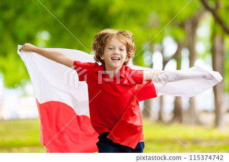 Child running with Poland flag. Little Polish fan 115374742