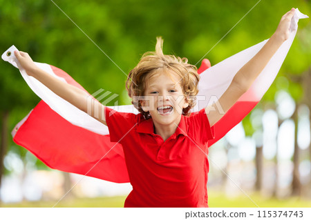 Child running with Poland flag. Little Polish fan 115374743