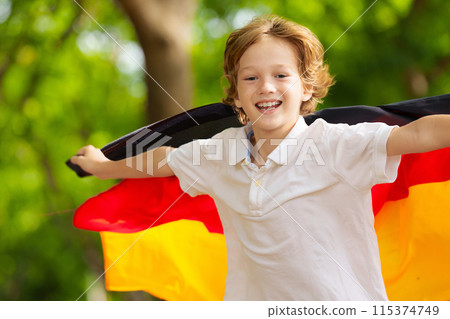 Child running with Germany flag. Child running with Germany flag. 115374749