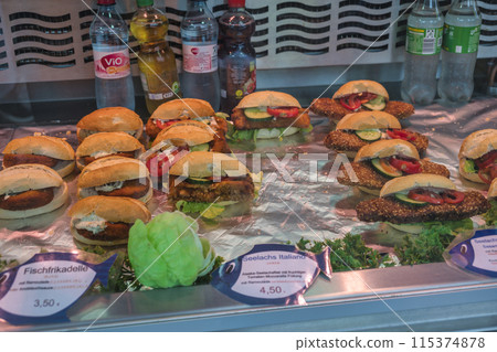 Hamburg, Germany - July 17, 2022: fish burger shop at famous Hamburg fish market (Fischmarkt) Hamburg, Germany - July 17, 2022: fish burger shop at famous Hamburg fish market (Fischmarkt) 115374878