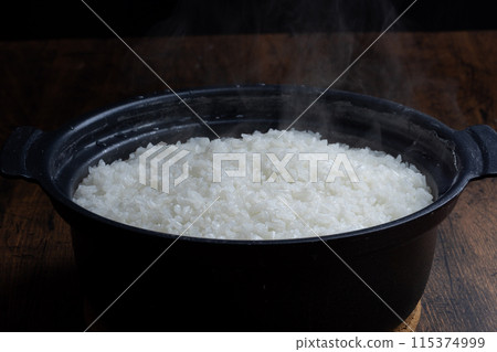 Freshly cooked rice in a clay pot Japanese food Freshly cooked rice in a clay pot Japanese food 115374999