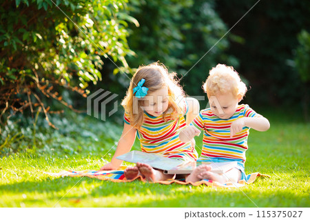 Kids play outdoor in sunny summer garden Kids play outdoor in sunny summer garden 115375027