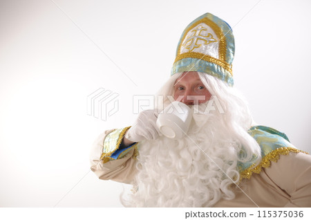 Photo of retired positive man hold mug delicious tasty beverage eggnog hot chocolate tea enjoy spending time Sinterklaas portrait. white background. Dutch Santa Claus St Nicholas christmas new year Photo of retired positive man hold mug delicious tasty beverage eggnog hot chocolate tea enjoy spending time Sinterklaas portrait. white background. Dutch Santa Claus St Nicholas christmas new year 115375036