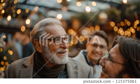 Elderly Man Smiling and Laughing with Friends at Festive Social Gathering. Grandparents World Day Elderly Man Smiling and Laughing with Friends at Festive Social Gathering. Grandparents World Day 115375061
