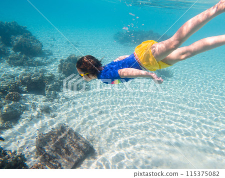 Child snorkeling. Kids underwater. Beach and sea. 115375082