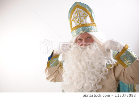 different positive emotions of St. Nicholas the Wonderworker who was founder of Santa Claus St. Nicholas is popularly called he is dressed in turquoise suit with gold with traditional religious cap 115375088