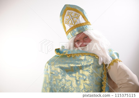 long cloak Saint Nicholas lifted with one hand and wrapped like a superman Sinterklaas portrait USA on a white background. Dutch Santa Claus St Nicholas christmas new year advertising space for text long cloak Saint Nicholas lifted with one hand and wrapped like a superman Sinterklaas portrait USA on a white background. Dutch Santa Claus St Nicholas christmas new year advertising space for text 115375115