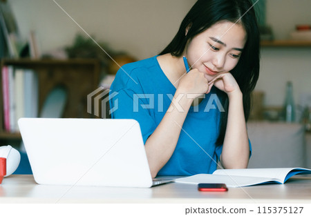 Women studying online Women studying online 115375127