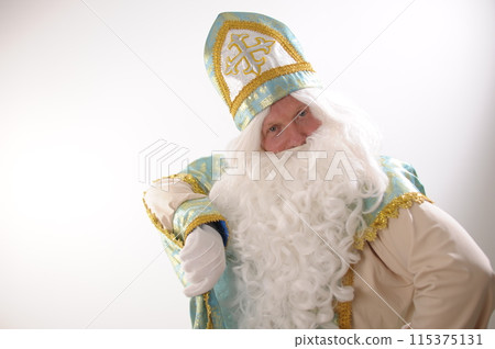 St. Nicholas conjures waving his hands creates magic Jolly Santa celebrates the new year at home. Christmas Eve, Santa Claus is dancingThe concept of a family, children's holiday 115375131