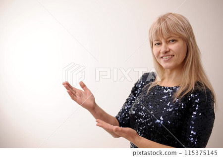 sincere laugh beautiful white teeth long hair Adult blond woman advertises something on white background, she turns and points to the side with her fingers, then shows her thumb into the frame sincere laugh beautiful white teeth long hair Adult blond woman advertises something on white background, she turns and points to the side with her fingers, then shows her thumb into the frame 115375145